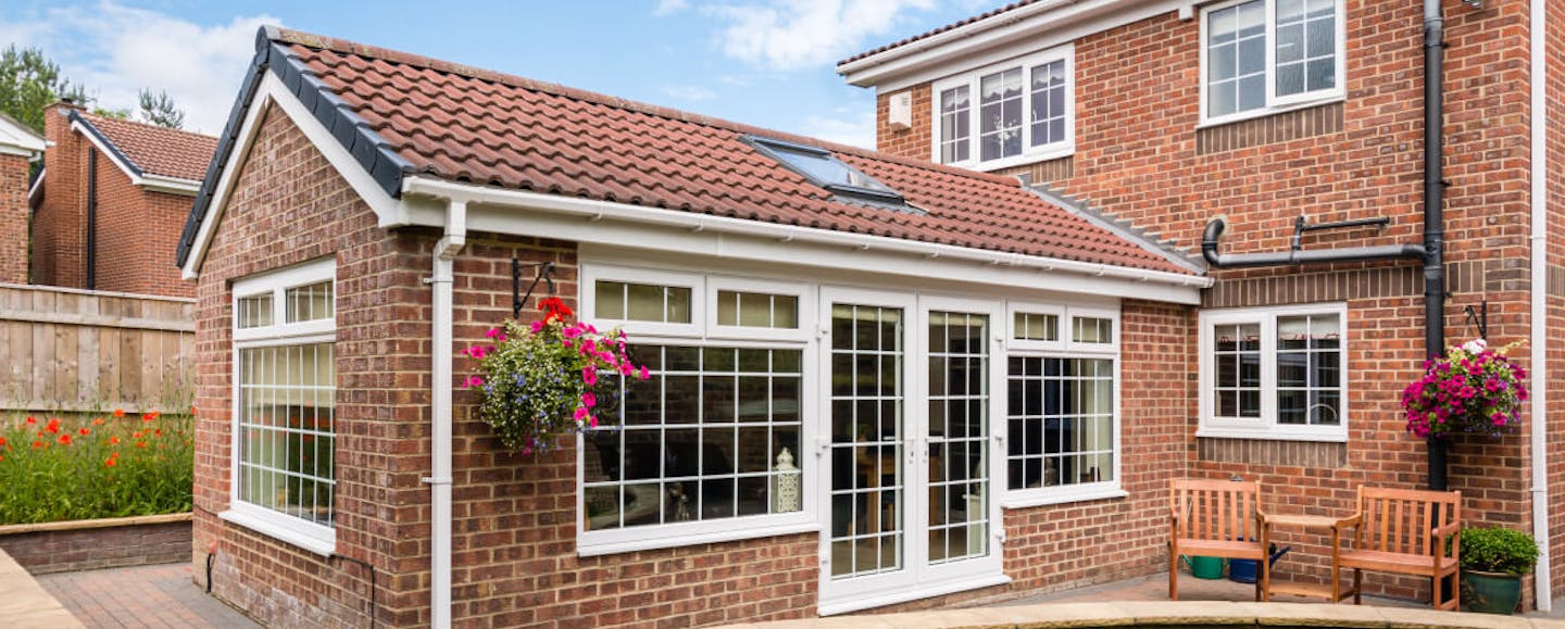 red brick house with a conservatory