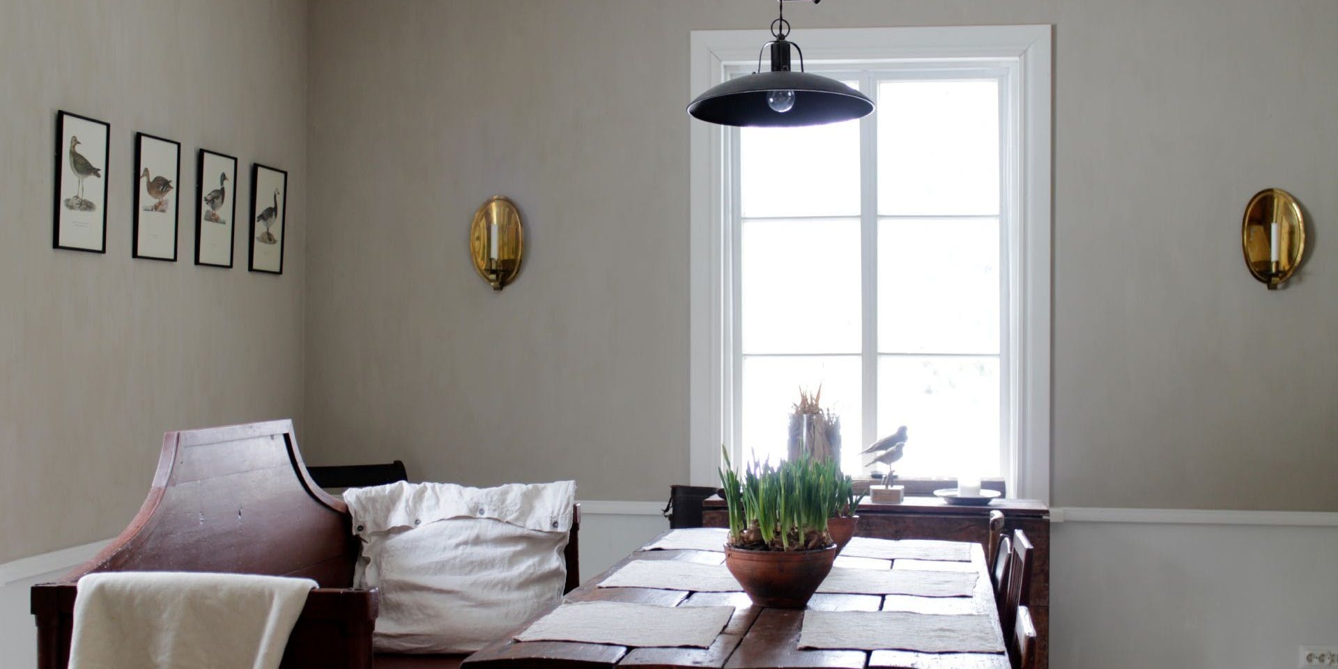 Textured Beige Dining Room with Burgundy Wooden Table