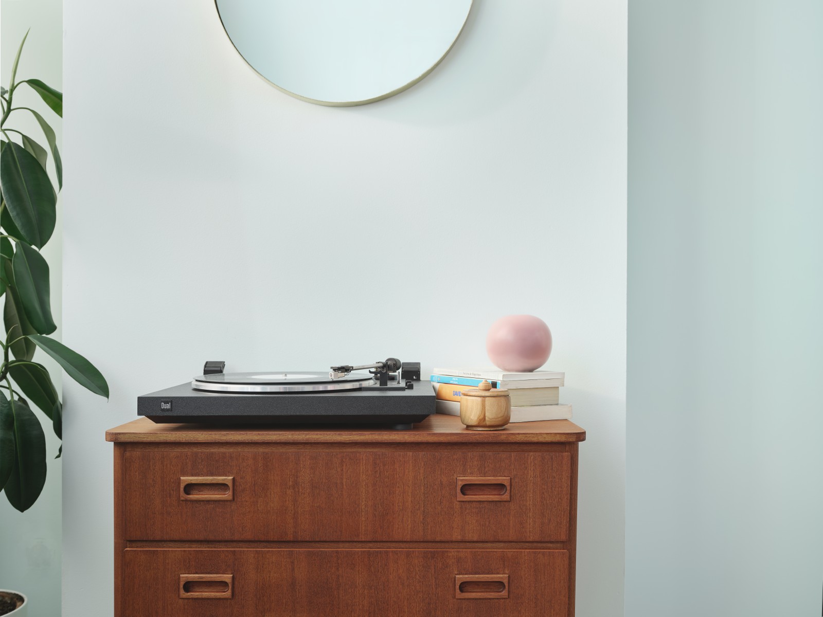 wooden cabinet against pale green wall painted in crystal g371