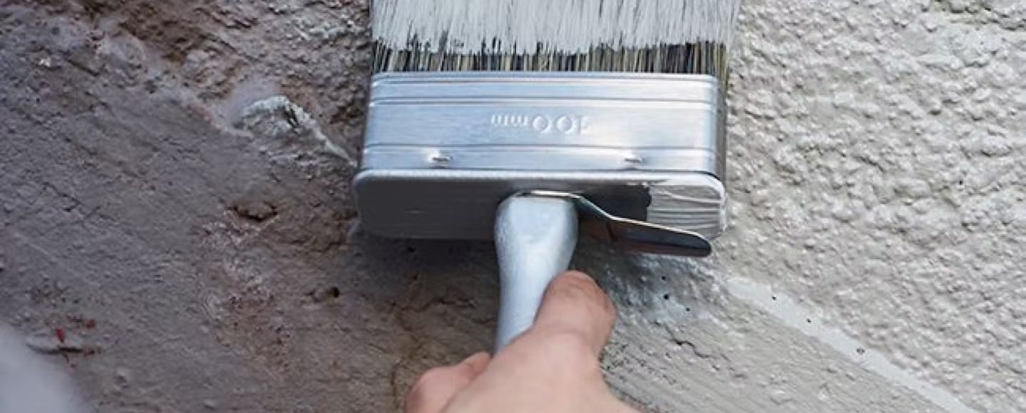 paint brush on exterior wall