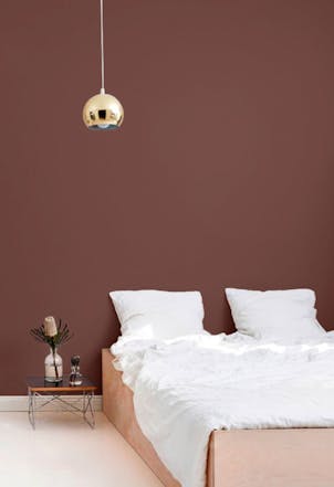 bedroom with a maroon wall