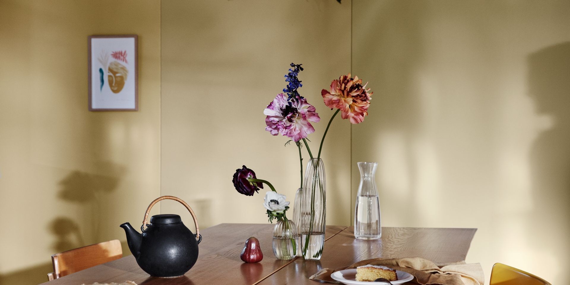 Yellow Kitchen Wall with Wooden Dining Table and Decorations