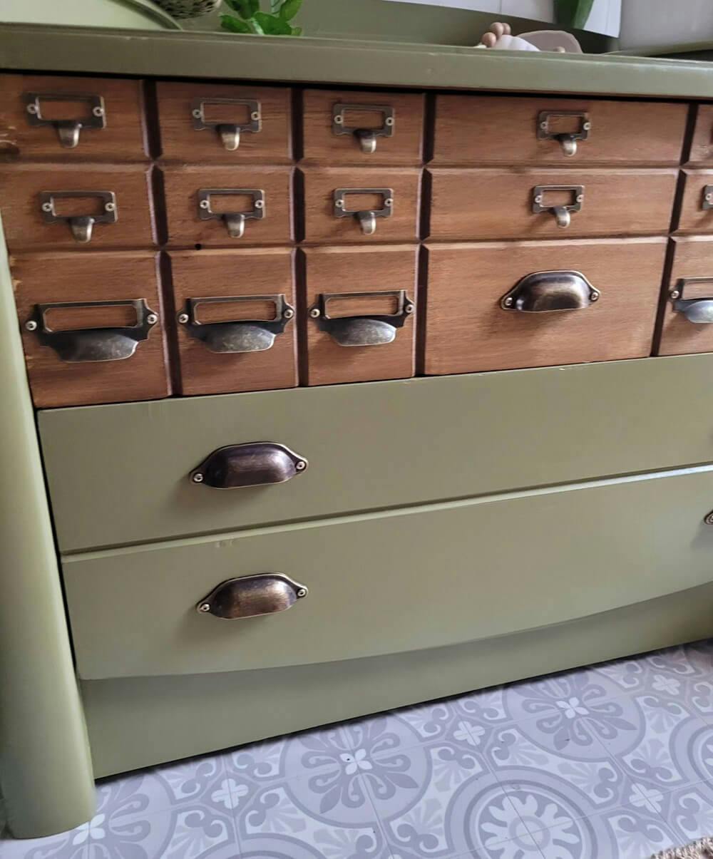 close up of olive green wooden cabinet