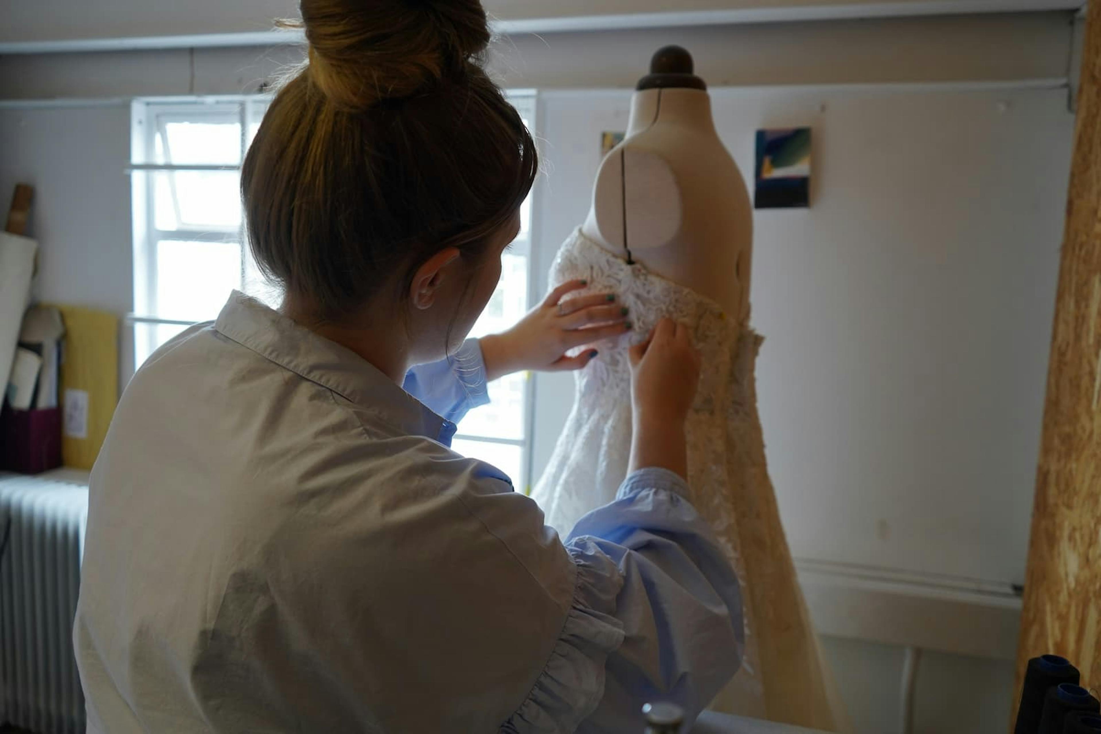 Tilly working on a dress