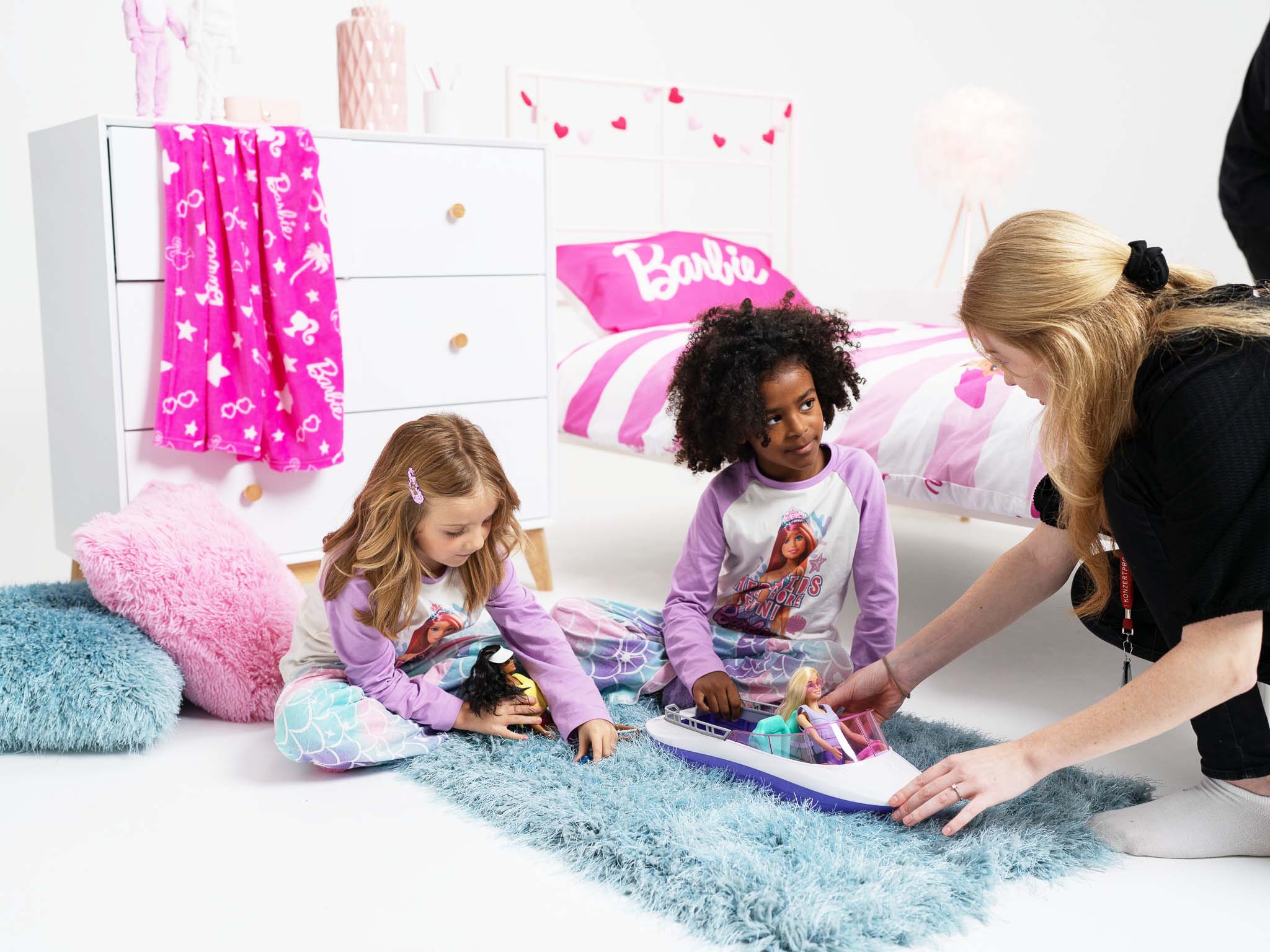 Director speaking to kids on set for a Barbie toys shoot