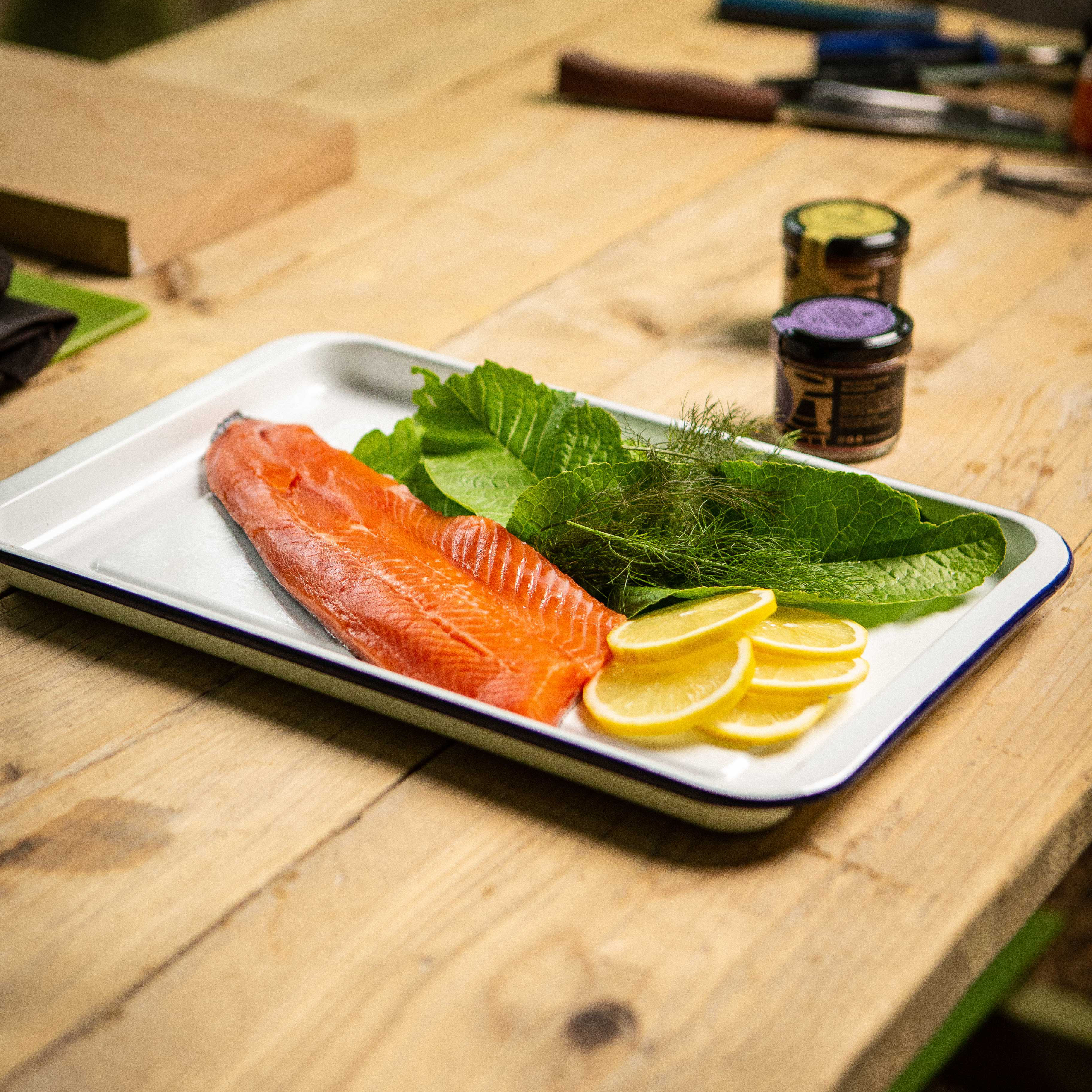 Food photography ingredients: rainbow trout, lemon, dill and leaves 