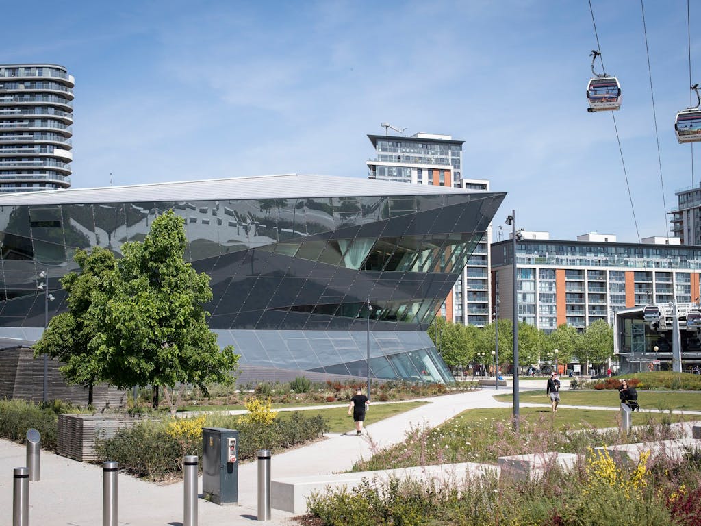 London City Hall glass building sat under a sky cable car