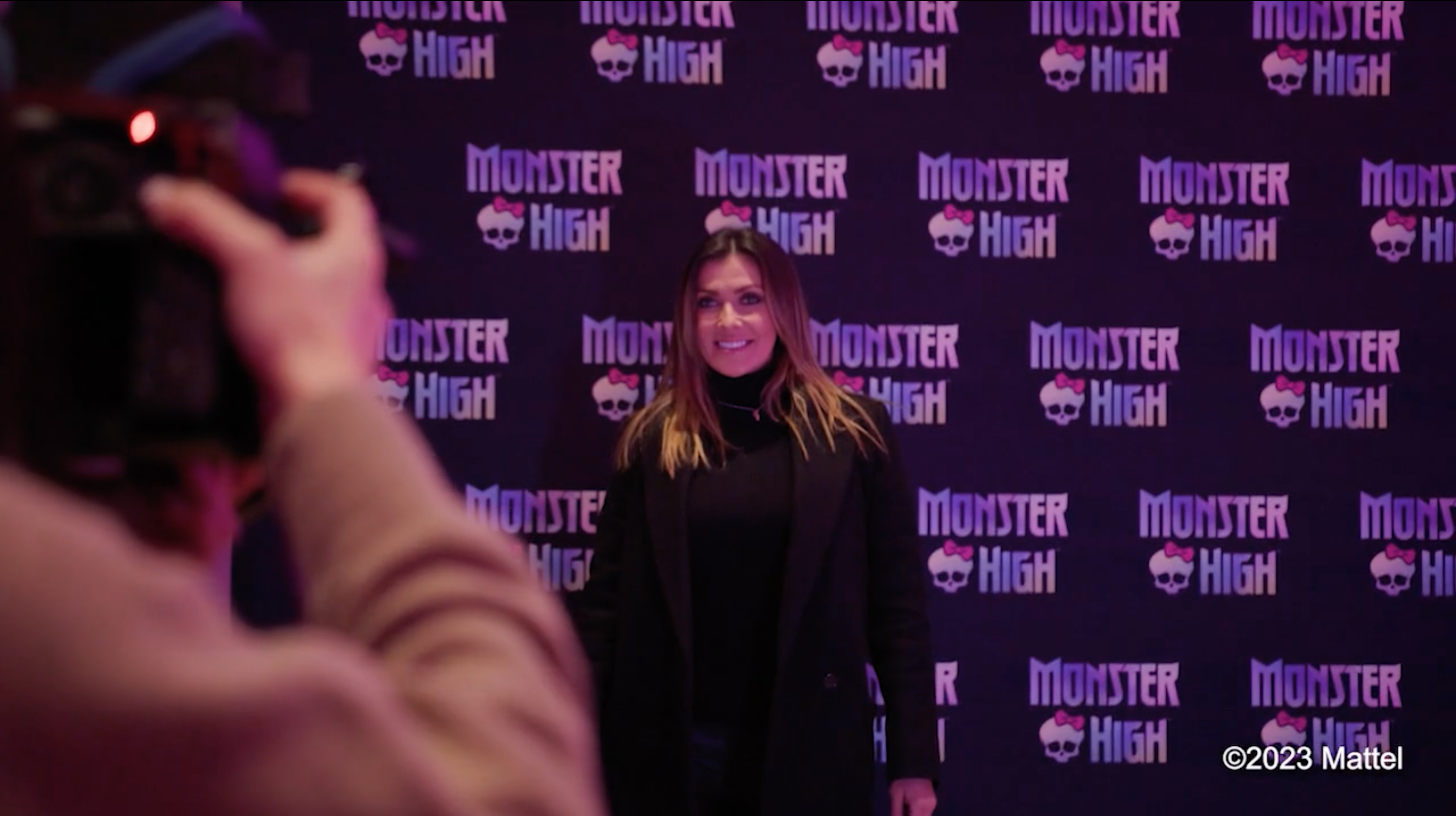 TV personality posing for a picture on a Monster High Red Carpet