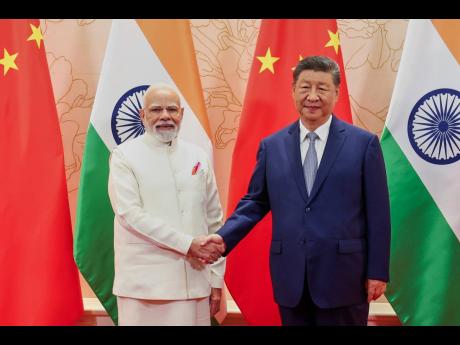 Xi and Modi vow to resolve border differences