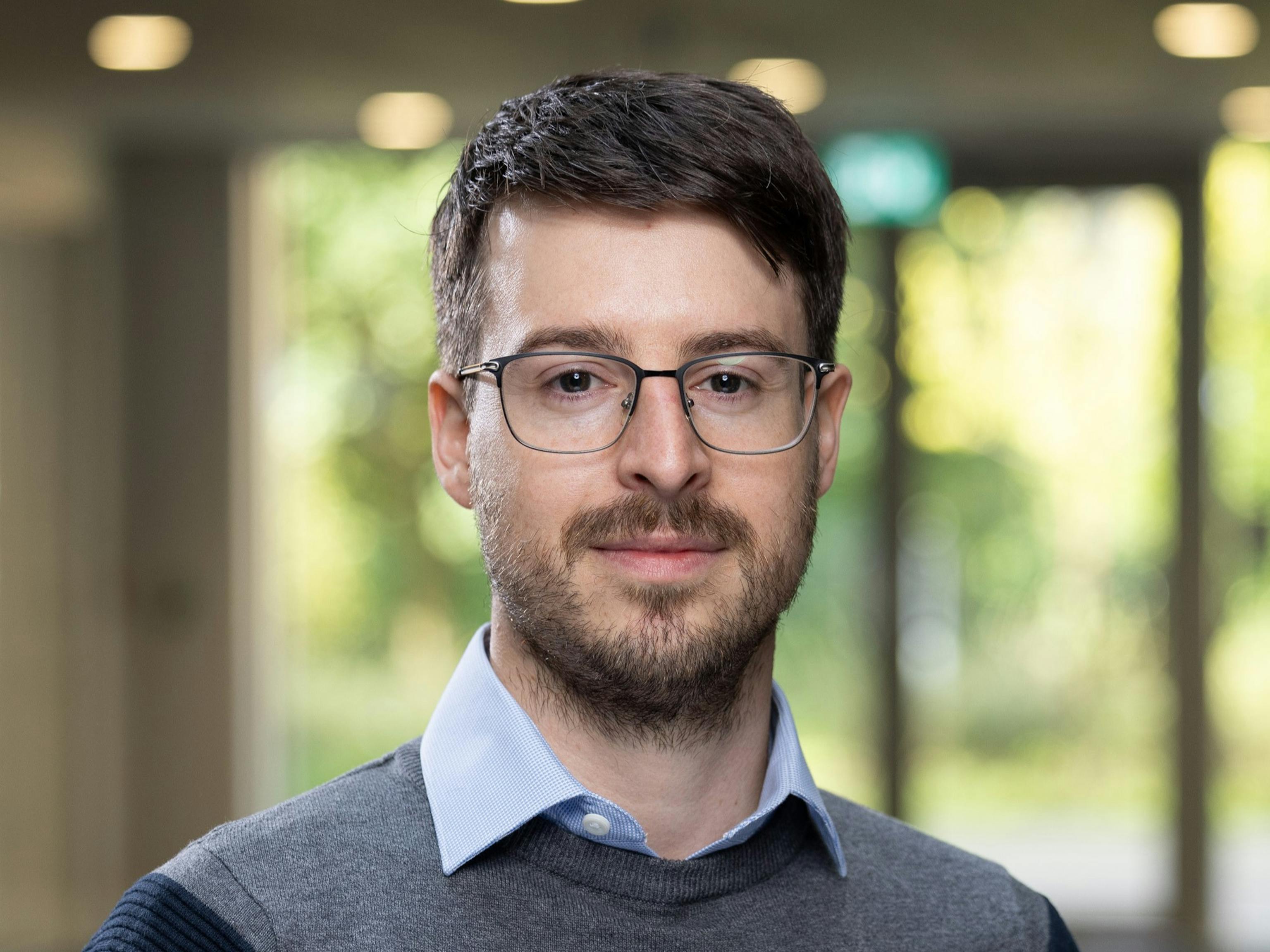 Headshot photo of Andrea Piovesan, a white male with dark hair, short beard and glasses