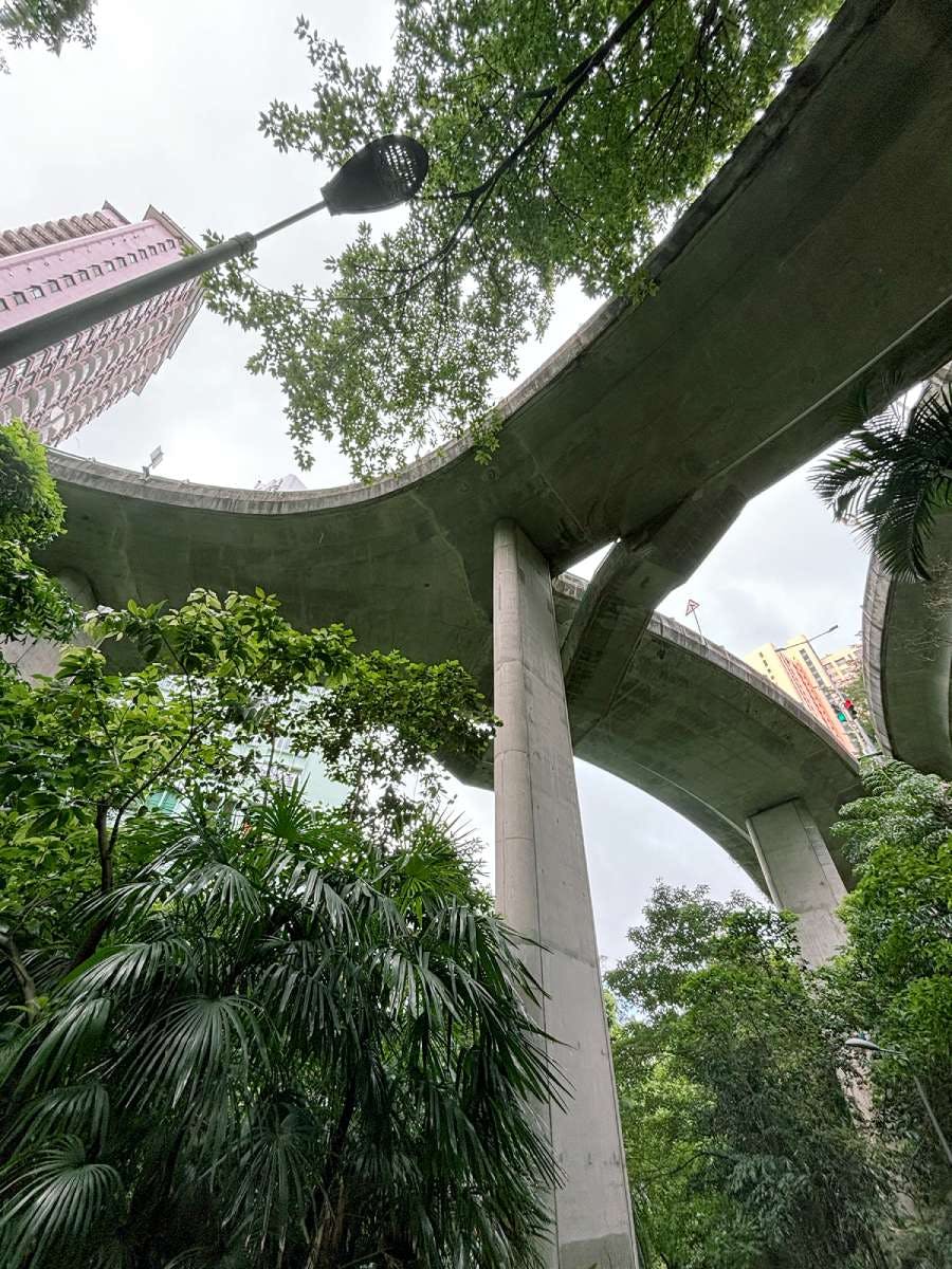 A looking-up view under a bridge