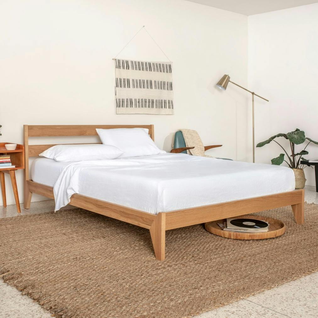 Tuft and Needle Wood Bed Frame in a room