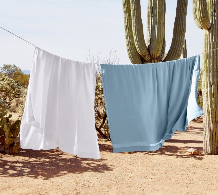 Hemp sheets hanging on a clothes line outside in the dessert
