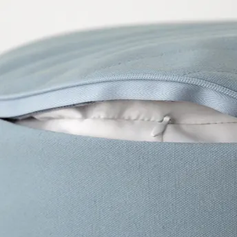 Close up of the Meditation Cushion zipper open, showing a polyester inner lining.
