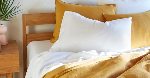 Pillows on a bed covered in hemp pillowcase set