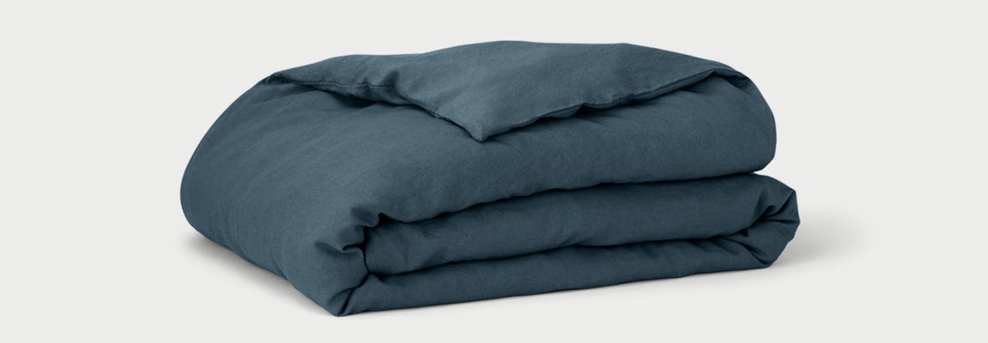 Folded Linen Duvet Cover on Duvet Insert in Slate color.
