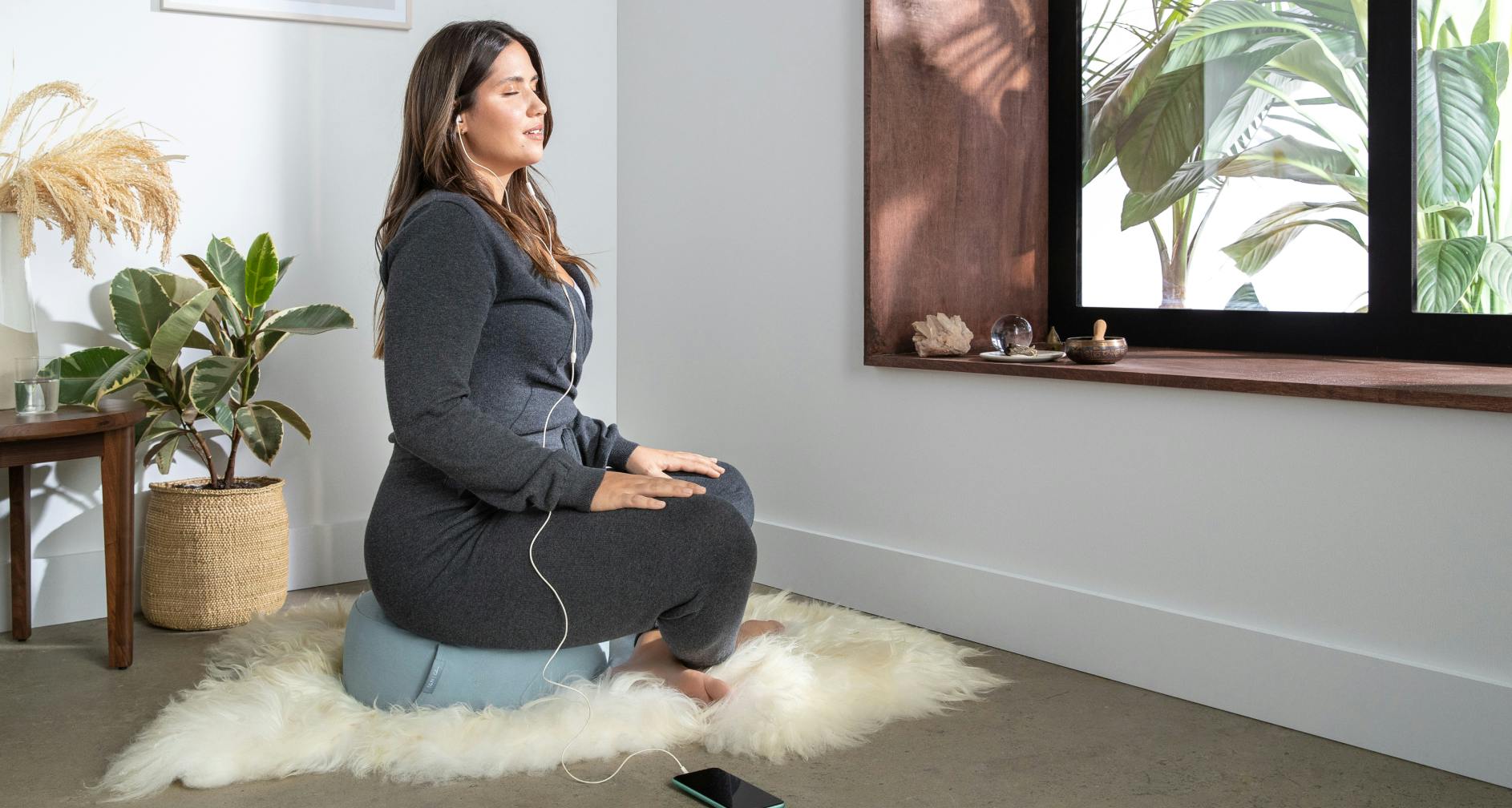 Woman sitting on T&N Meditation Cushion