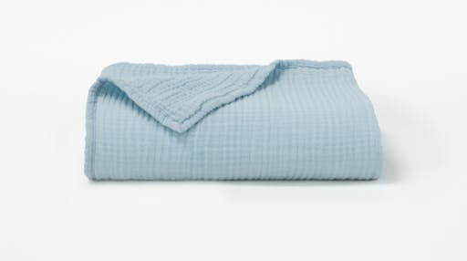 Our Organic Muslin Toddler Blanket in the color Sea folded