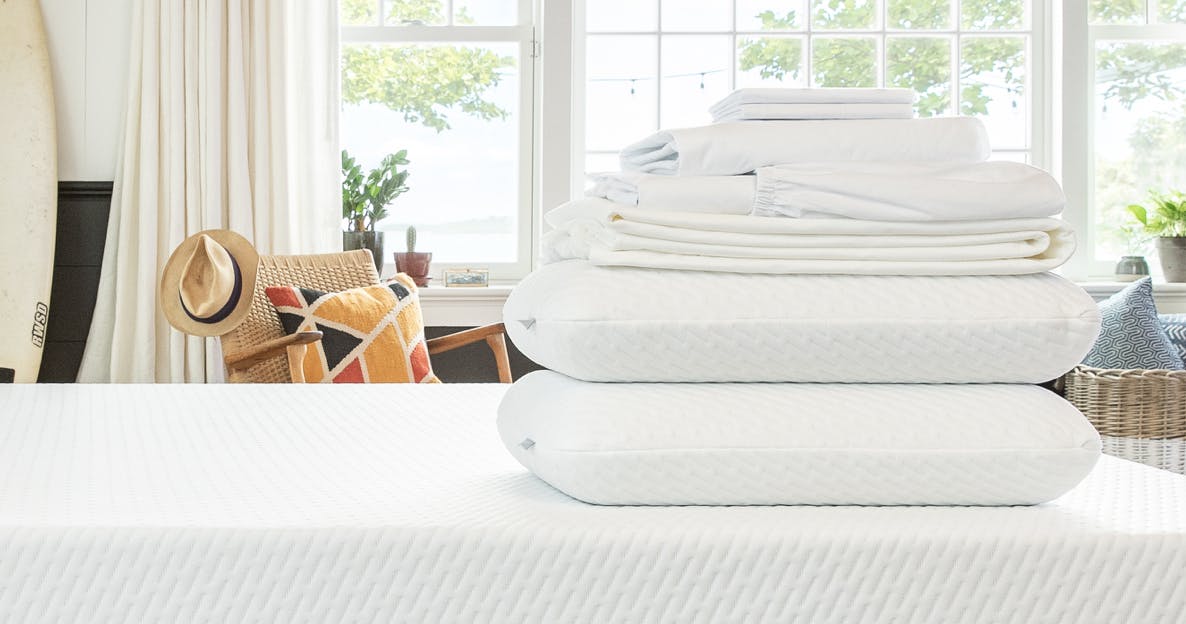 Tuft and Needle original foam pillows and bedding on a mattress