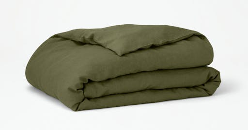 Folded Linen Duvet Cover on Duvet Insert in Moss color. 