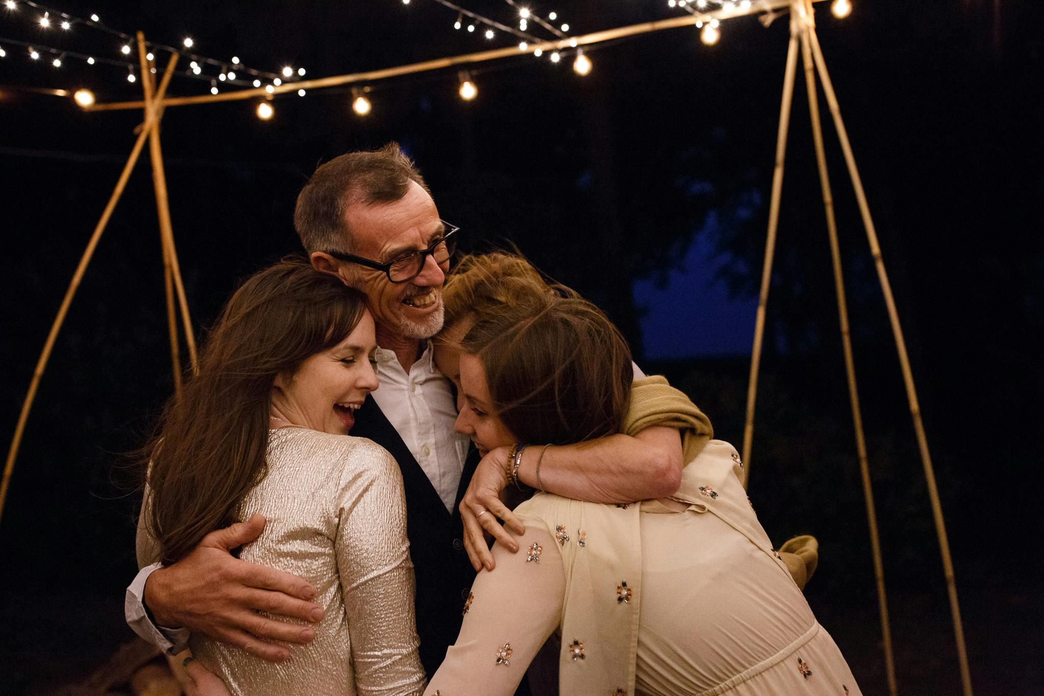 Man hugging family
