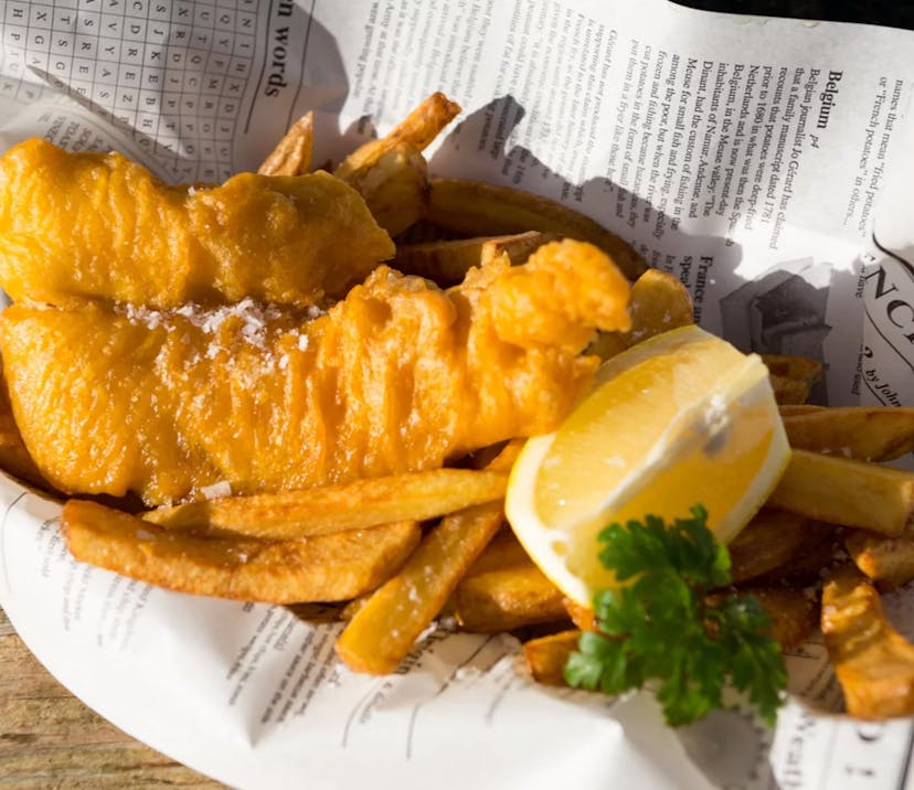 fish and chips in paper with lemon
