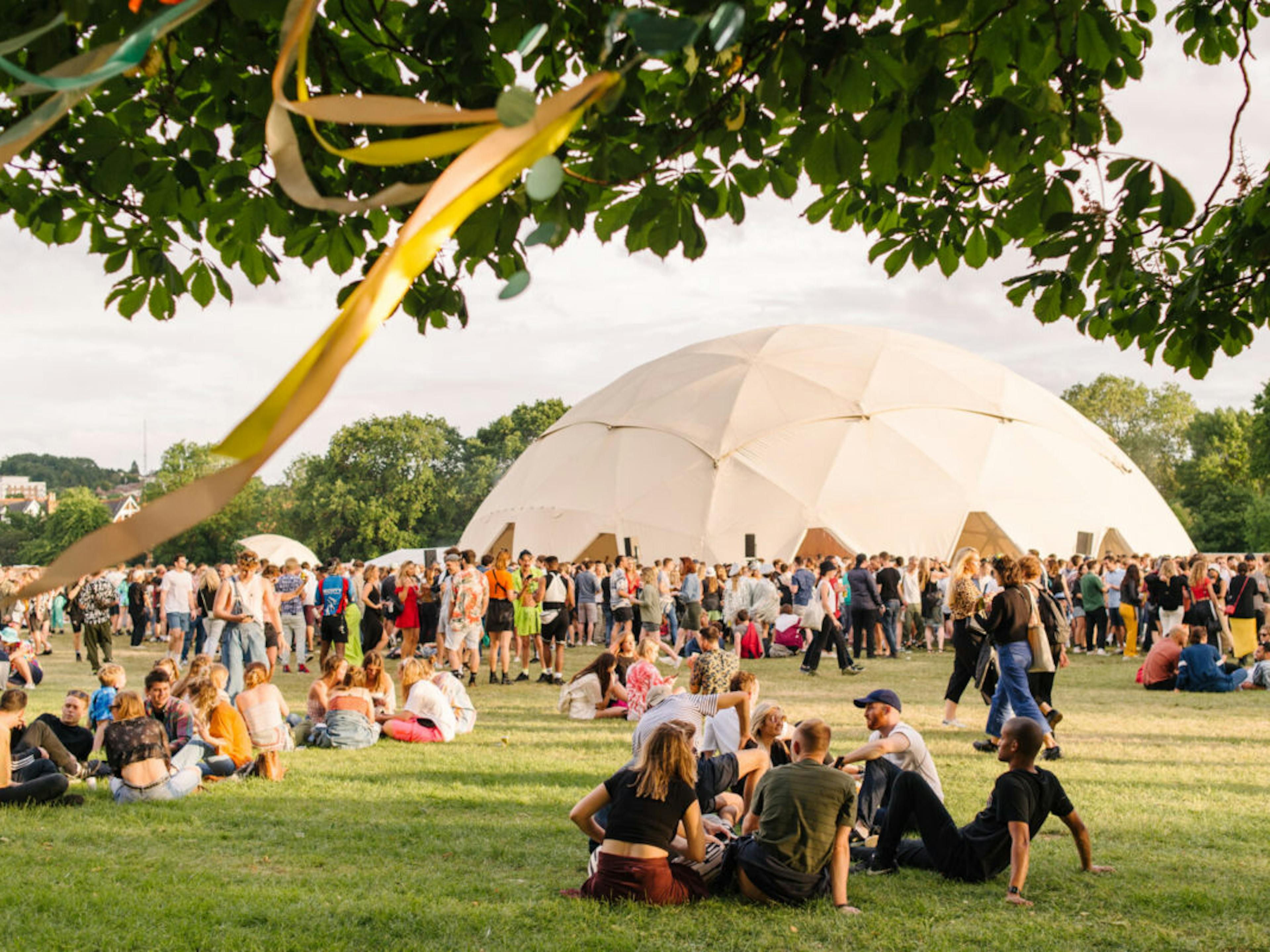 groups of people sitting at festival