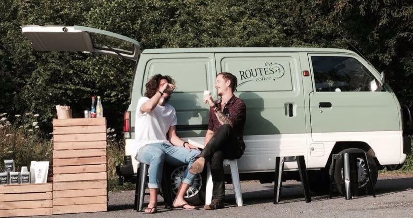 two people sat outside a mobile bar