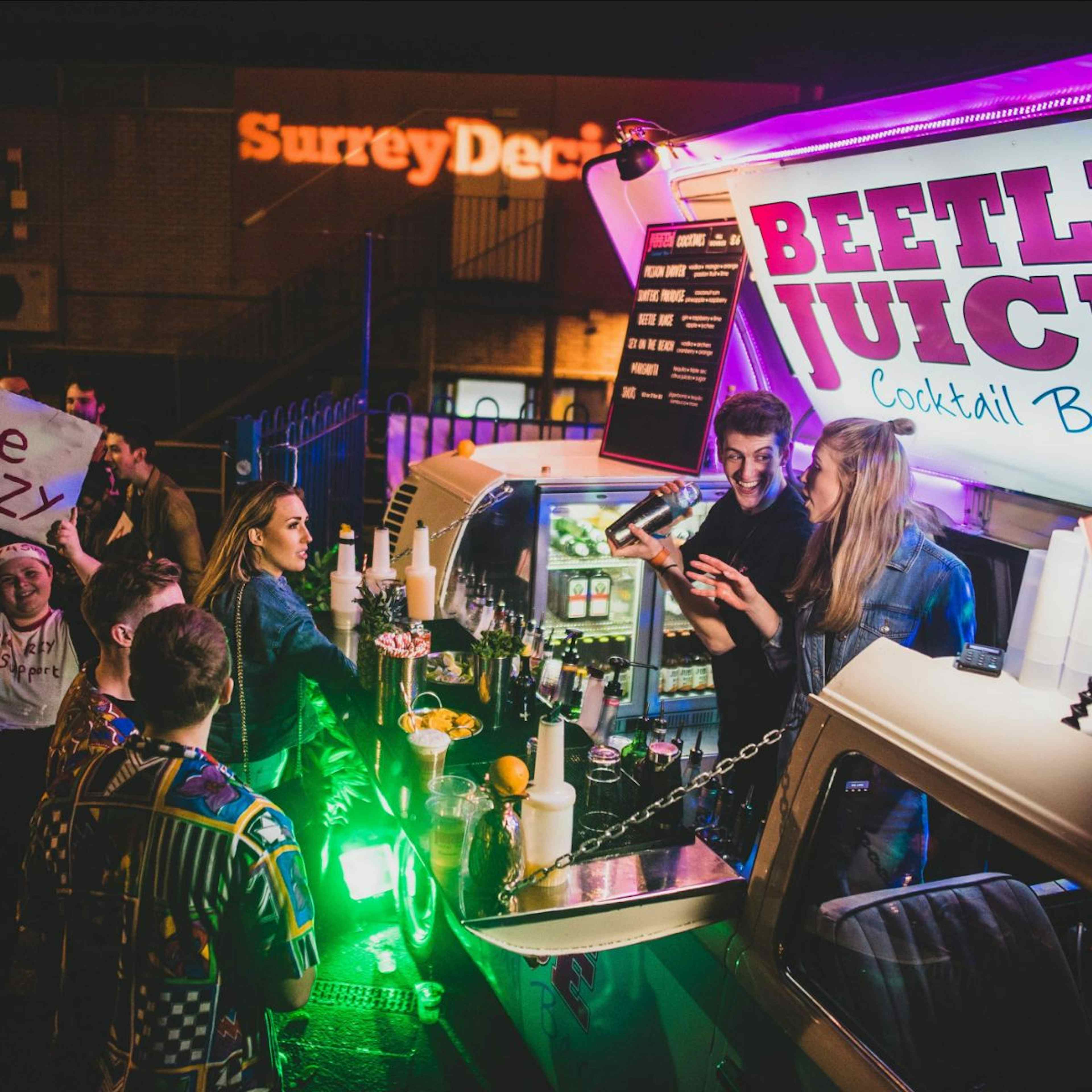 Beetle Juice Events shaking cocktails at an event