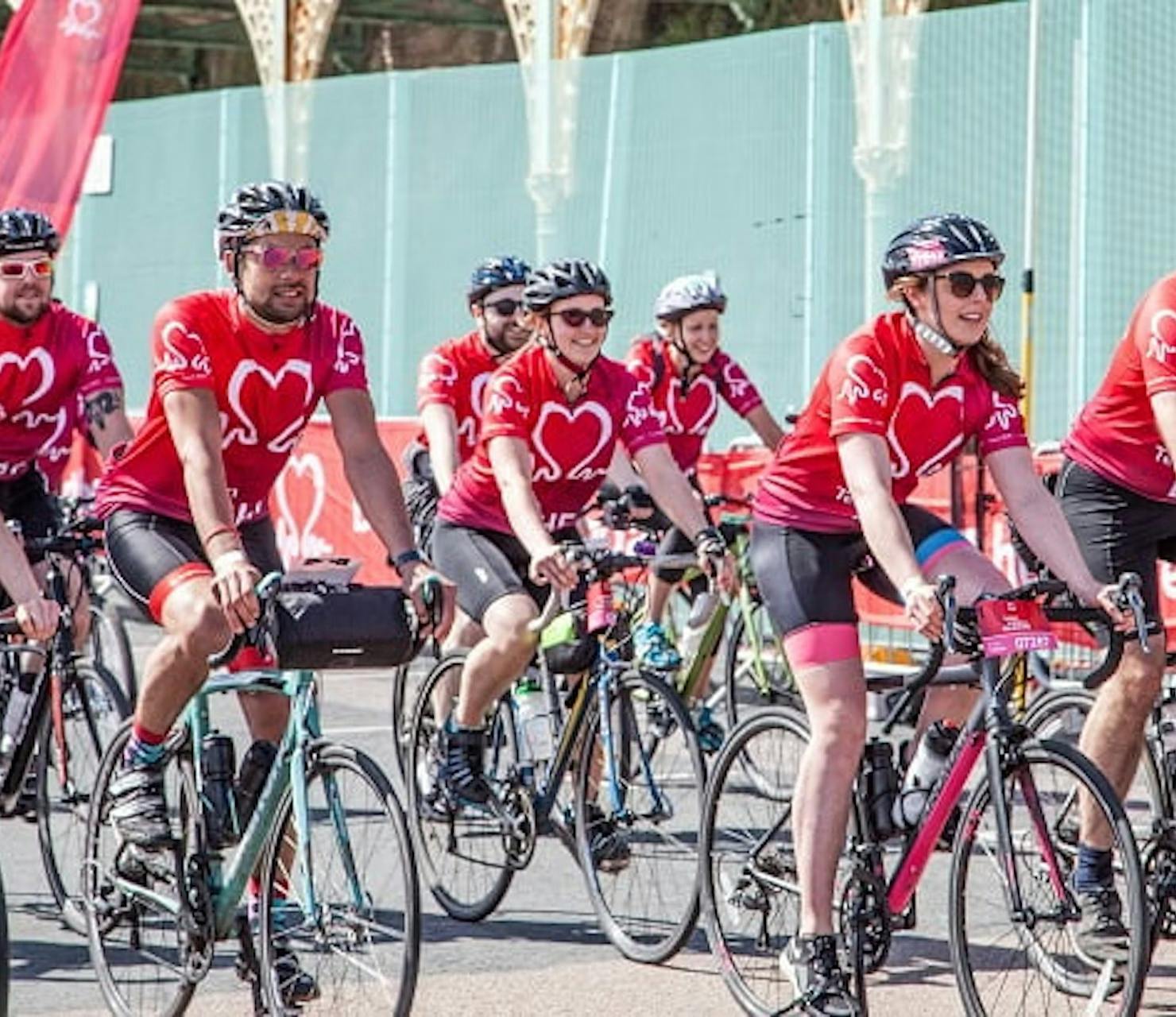 people on bikes in red