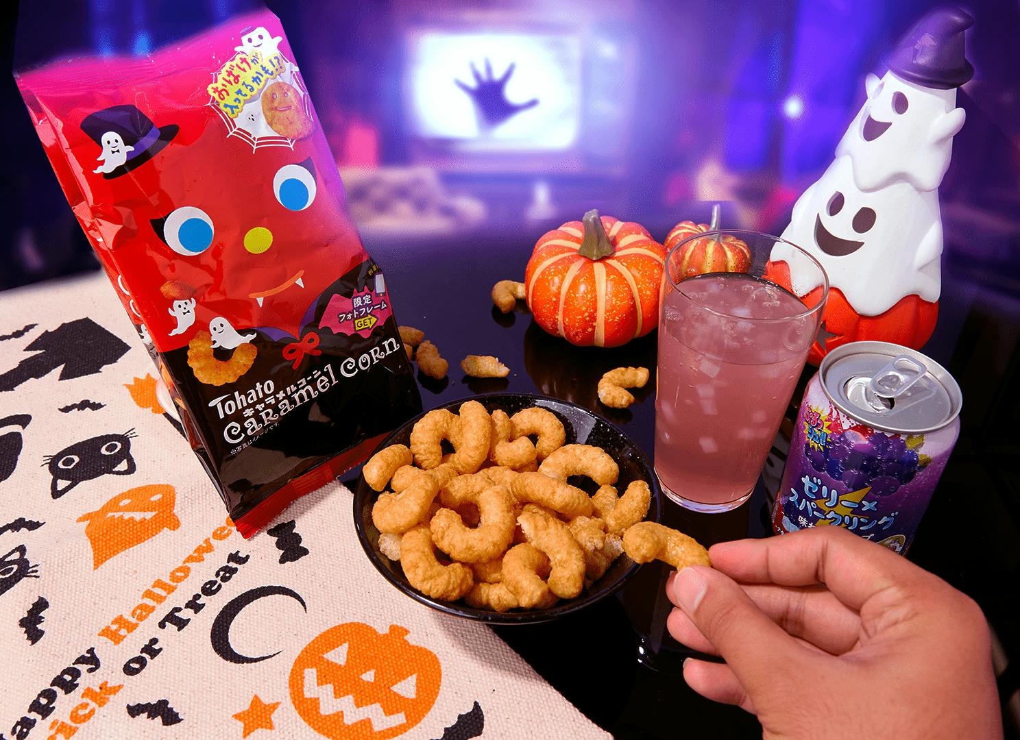 A man eating Tohato Caramel Corn during Halloween movie marathon. A man eating Tohato Caramel Corn during Halloween movie marathon.