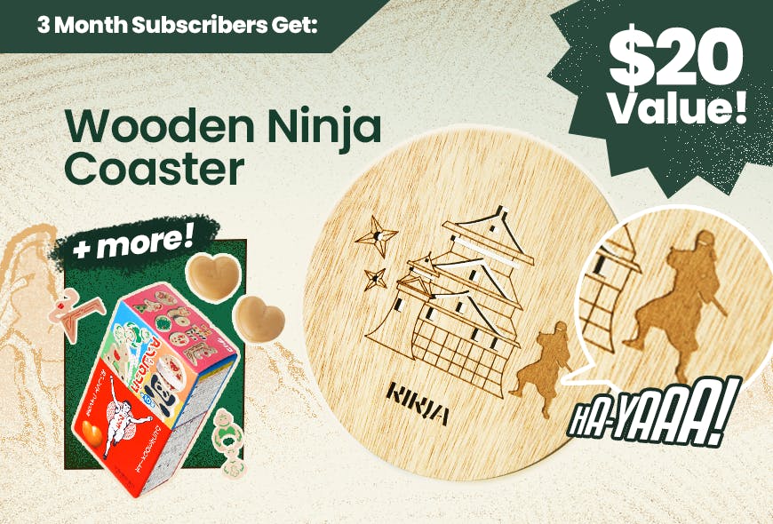 TokyoTreat's 3 month bonus is pictured including a ninja coaster with a Japanese castle and Glico Running Man caramels