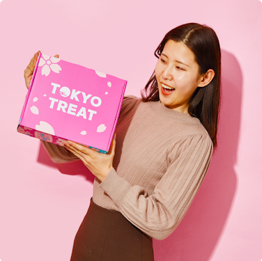 Founder Ayumi Chikamoto holding TokyoTreat snack box