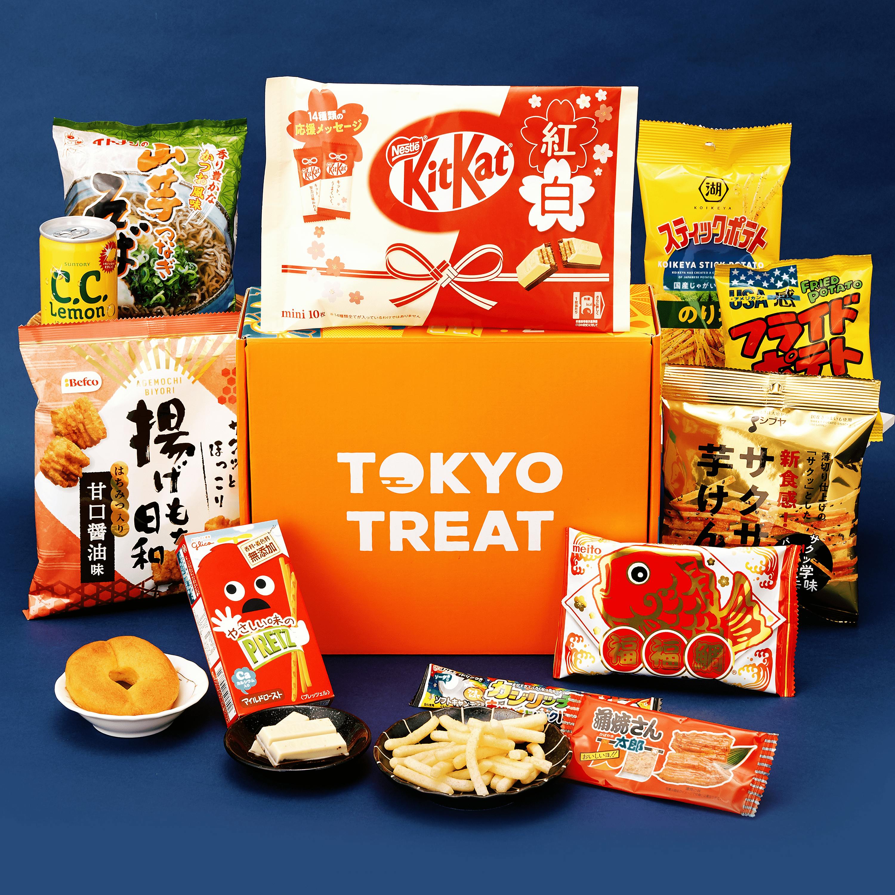 The TokyoTreat New Year's box sits a dark blue background surrounded by the box items.