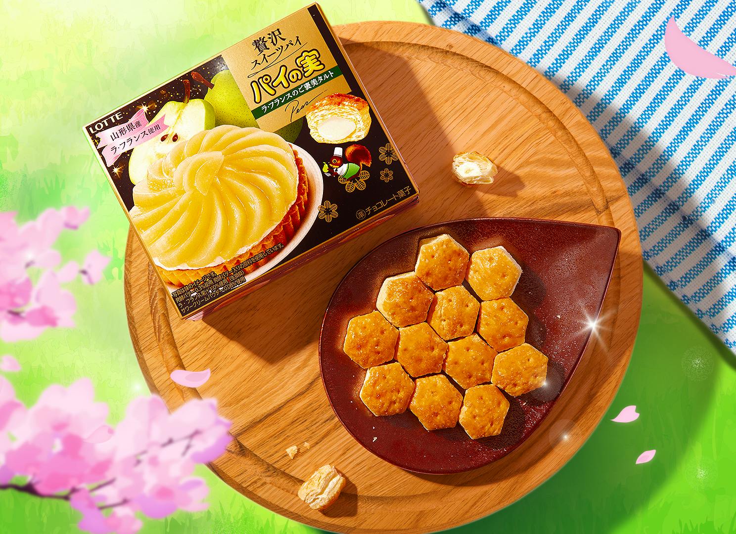 Pai no Mi Mini Pies sits on a wooden tray at a cherry blossom picnic, surrounded by Japanese cherry blossoms.