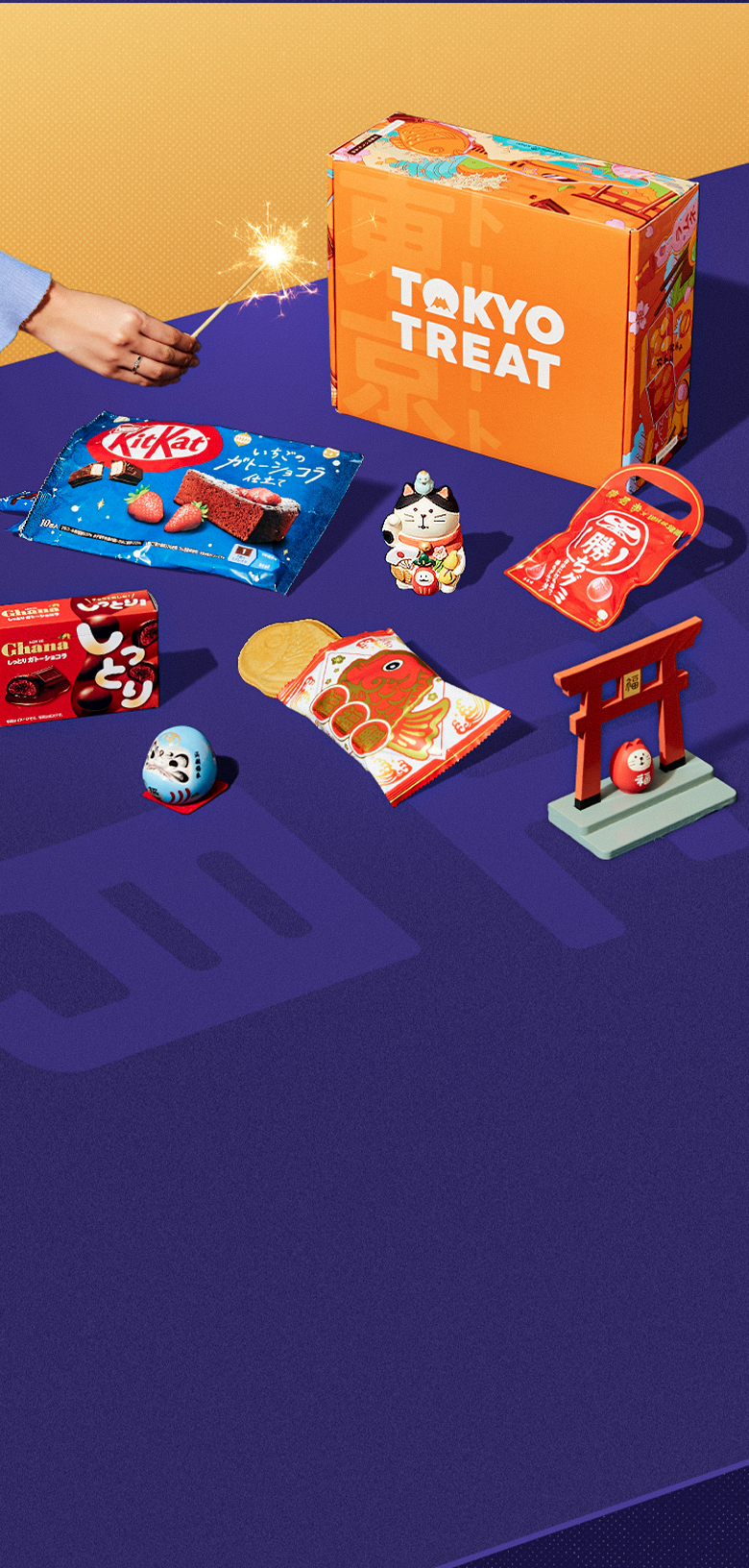 The TokyoTreat box surrounded by the most delicious Japanese snacks.