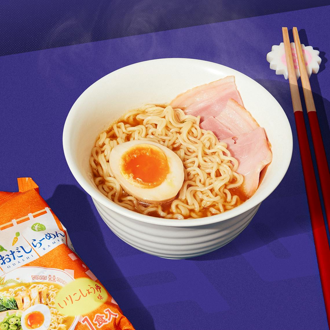 A bowl of ramen on a blue background.