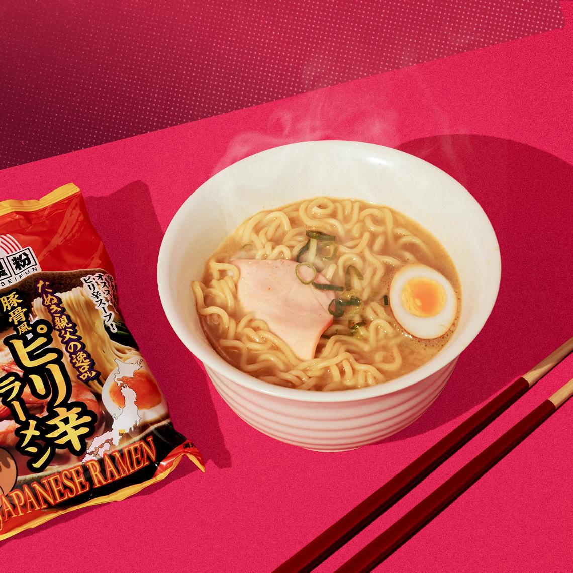 Ramen on a red background.