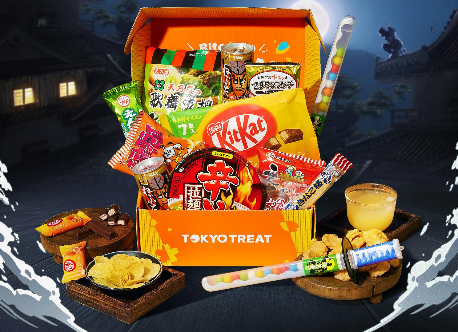 TokyoTreat Ninja Snackventure box sits on the roof of an old wooden Japanese house, surrounded by box main items.