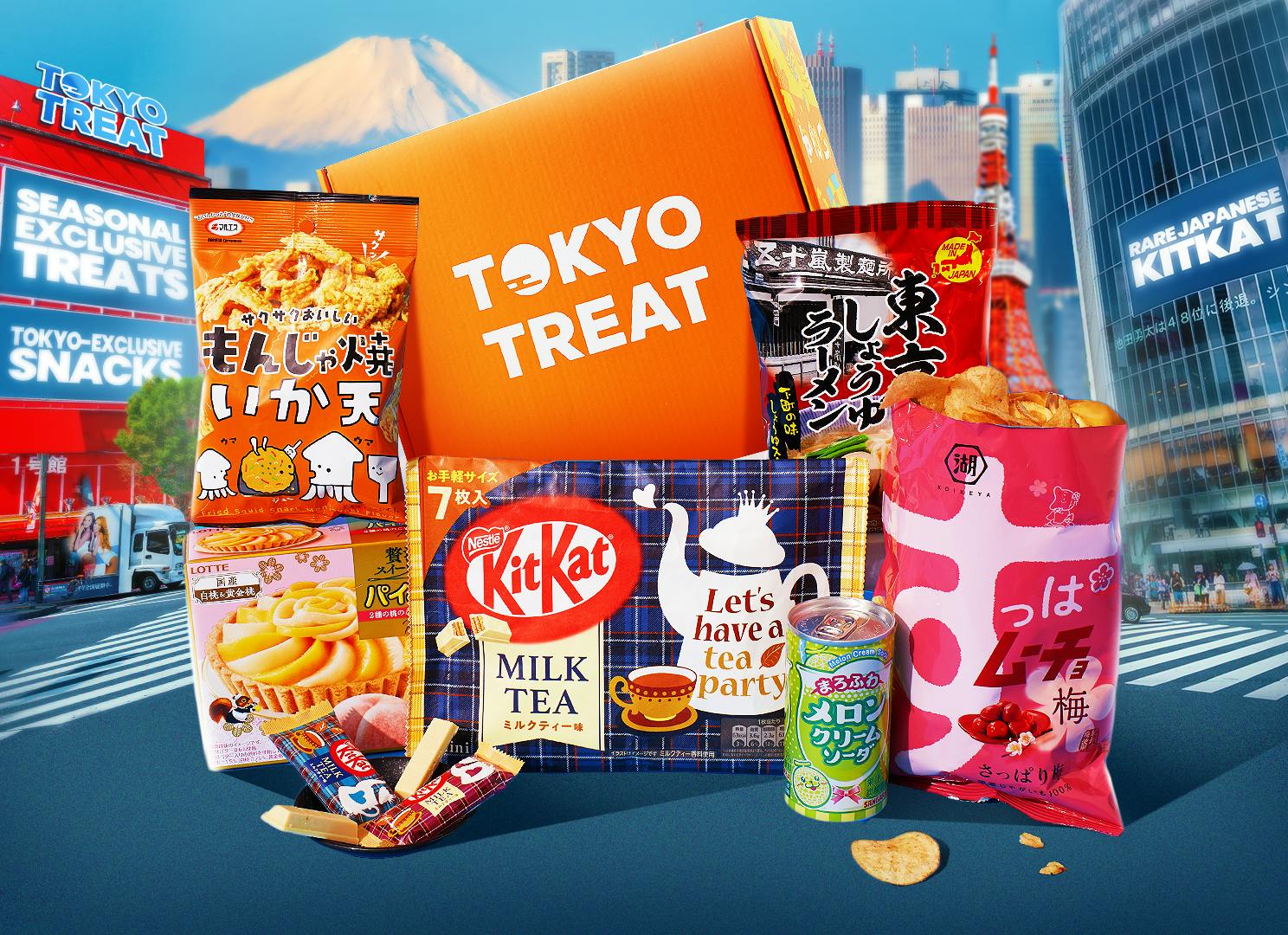 The Tokyo Snackation box items sit against a backdrop of a Tokyo cityscape.