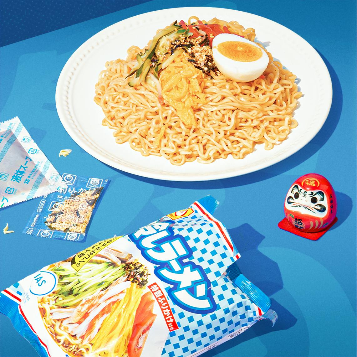 Hiyashi Ramen sits on a blue background, surrounded by Japanese summer festival motifs.