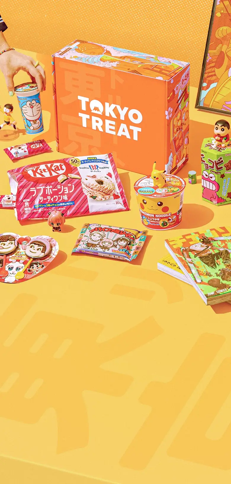 TokyoTreat box sits on a bright orange-yellow background, surrounded by Japanese snacks, with one hand reaching for a snack.