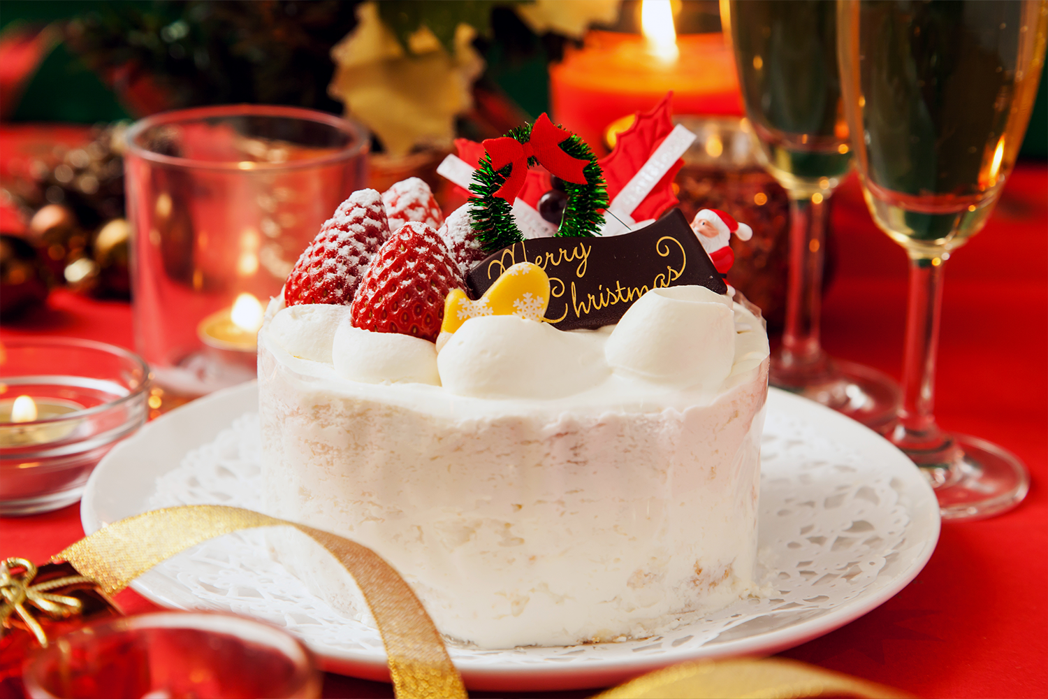 A Christmas cake from Japan sits on a brightly decorated table.