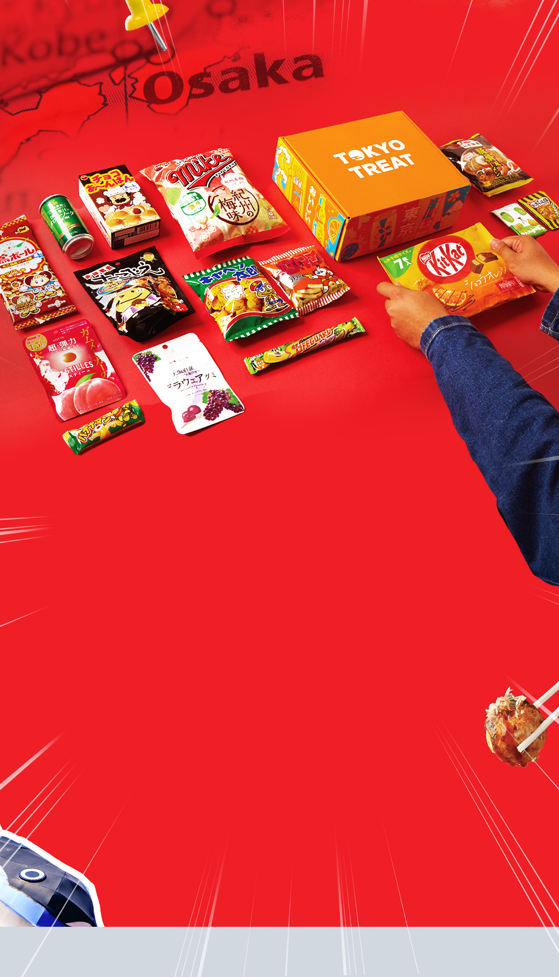 TokyoTreat box sits on a red background, surrounded by box items.