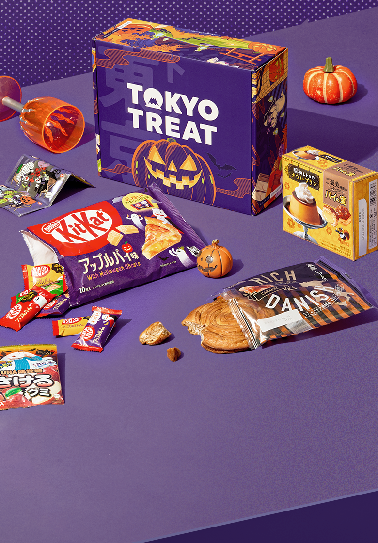 The Snacktastic Halloween box surrounded by the various snacks featured in the box.