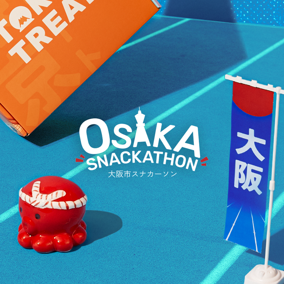 The Osaka Snackathon logo on a blue background next to a TokyoTreat box.