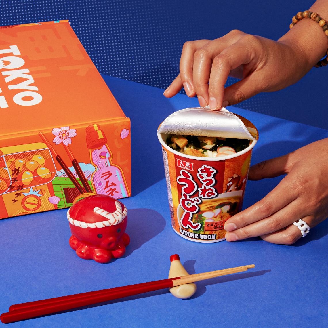 Hot kitsune udon on a blue background.