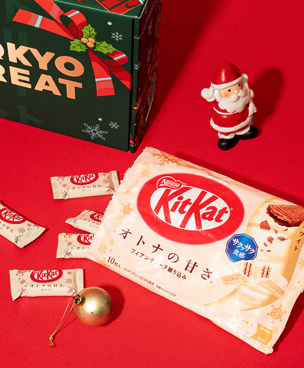 Delicious White Chocolate and Crepe KitKats against a red background.