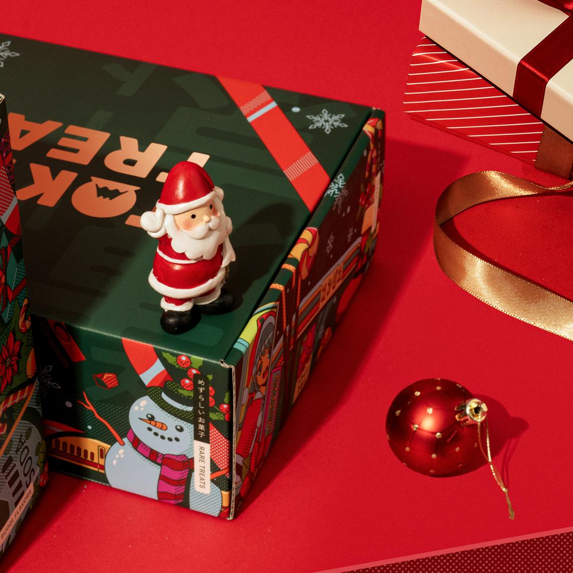 The Very Merry Christmas box on a red background.