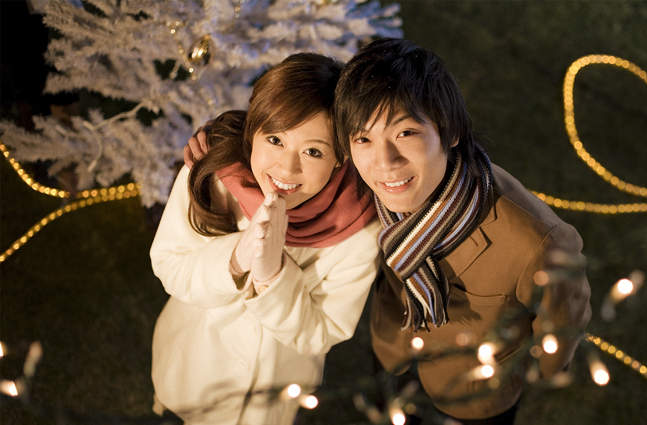 A couple in awe of the holiday season.